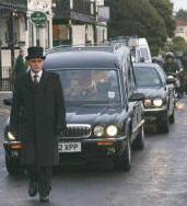 The hearse leaving