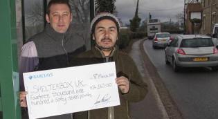 Greg Davis and Juan Romero with a £14,167 cheque for ShelterBox