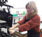 Sara Harrinton using the small Columbian press