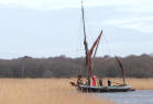 Daddy Christmas arriving on the Thames sailing barge Cygnet