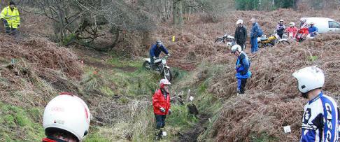 Riders surveying a particularly muddy section