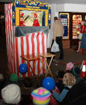 Punch and Judy outside Boots